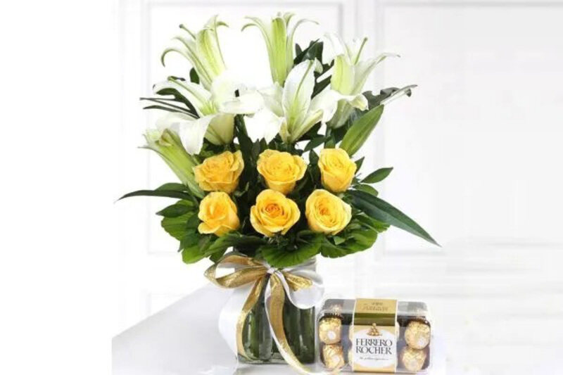 Carmel Flowers Lovely Combo of 3 Stem Lilly & 6 Stem Yellow Roses with 16 Ferrerro, Multicolour
Carmel Flowers Lovely Combo of 3 Stem Lilly & 6 Stem Yellow Roses with 16 Ferrerro, Multicolour
