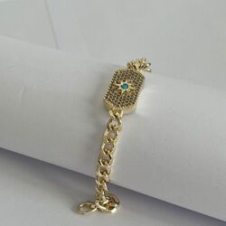 Sun charm and blue dot chain bracelet